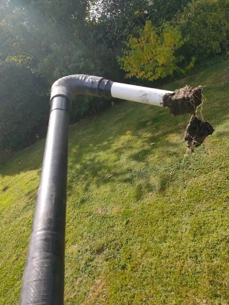 Reigate downpipe vacuum clearing debris